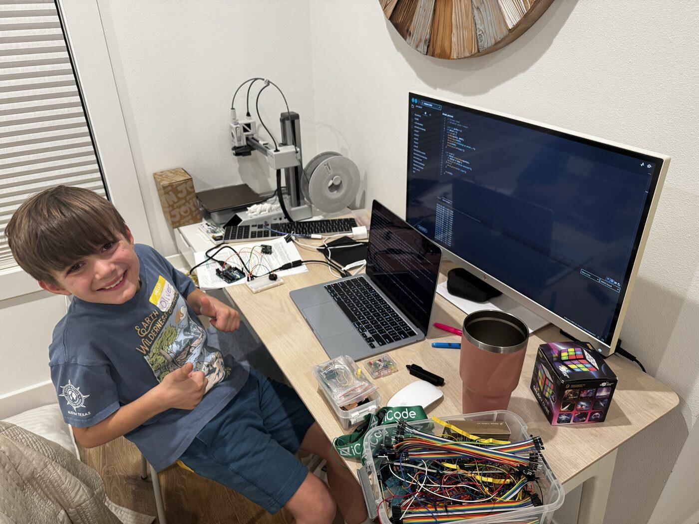 Oliver at his desk using stirfry