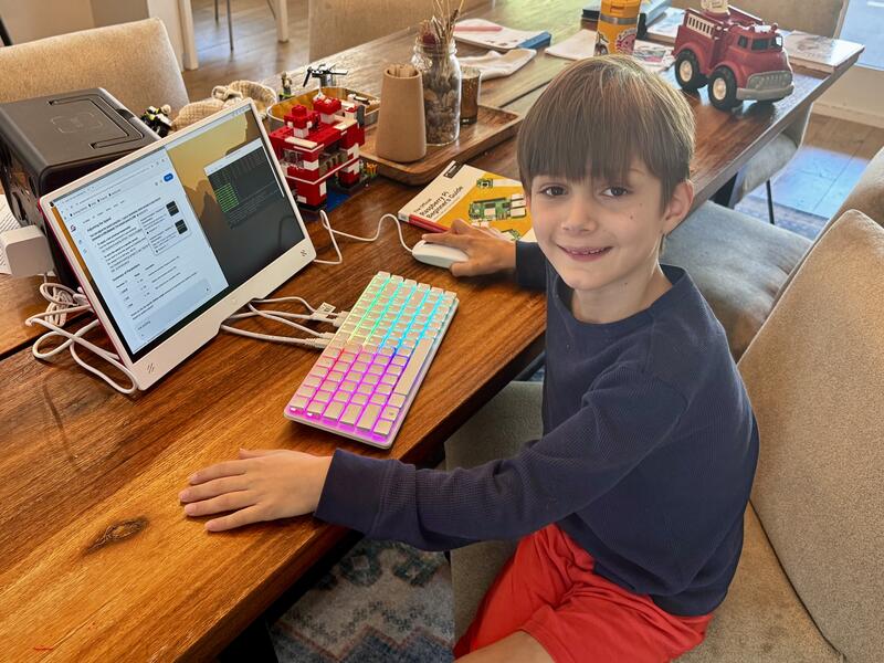 Oliver using stirfry on the Raspberry Pi 500+ with RGB keyboard and Pi Monitor